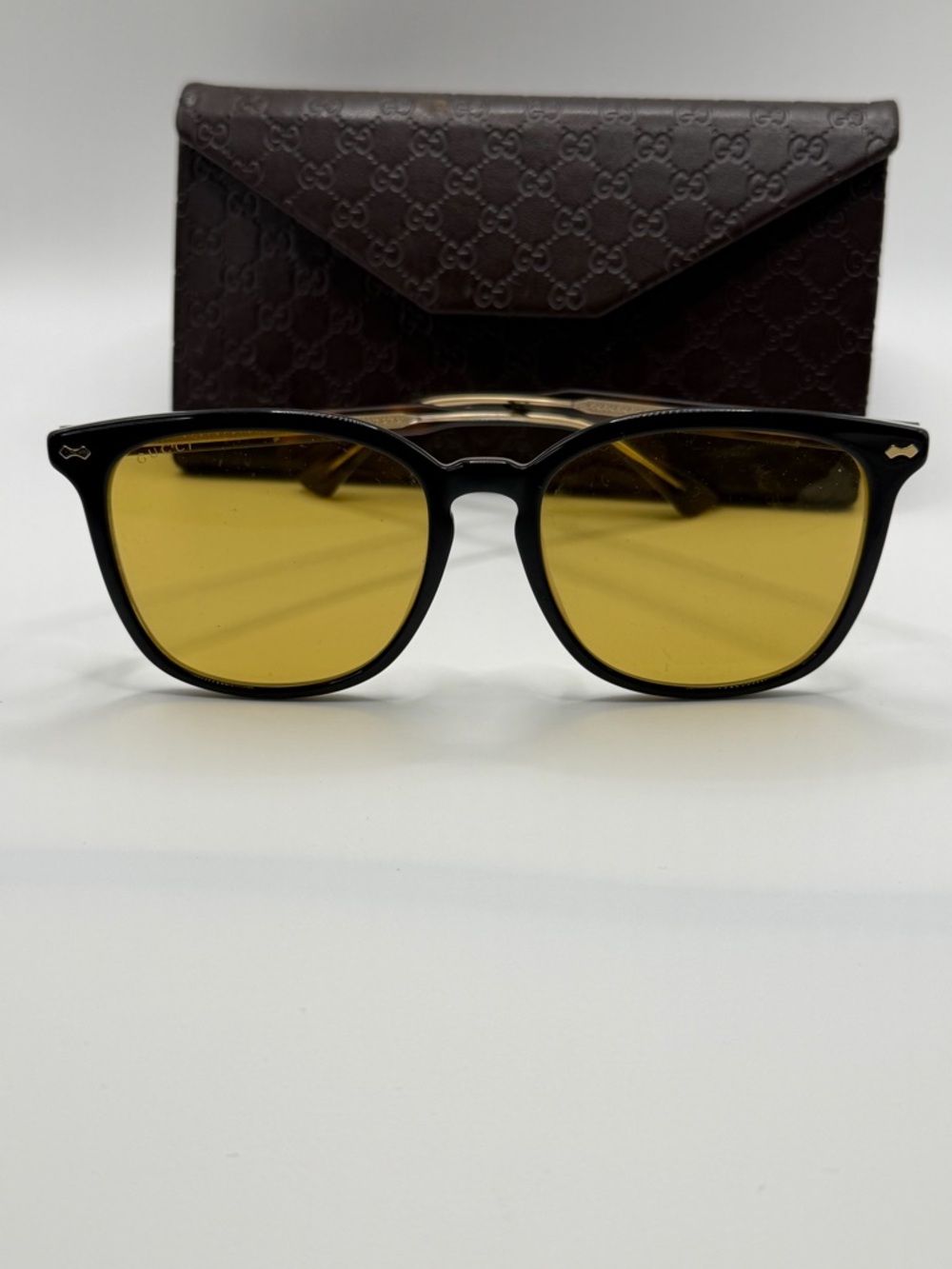 Gucci Black Frame Sunglasses with Yellow Lenses